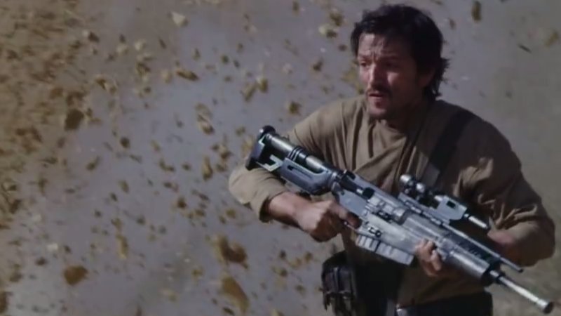 Cassian with his rifle.