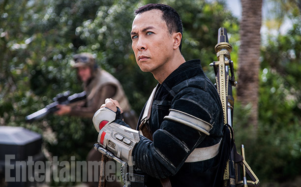 Chirrut carrying his weapon.