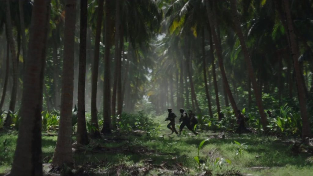 Rebels running through the jungle on Scarif.