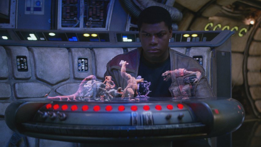 Finn looking at a dejarik board in The Force Awakens.